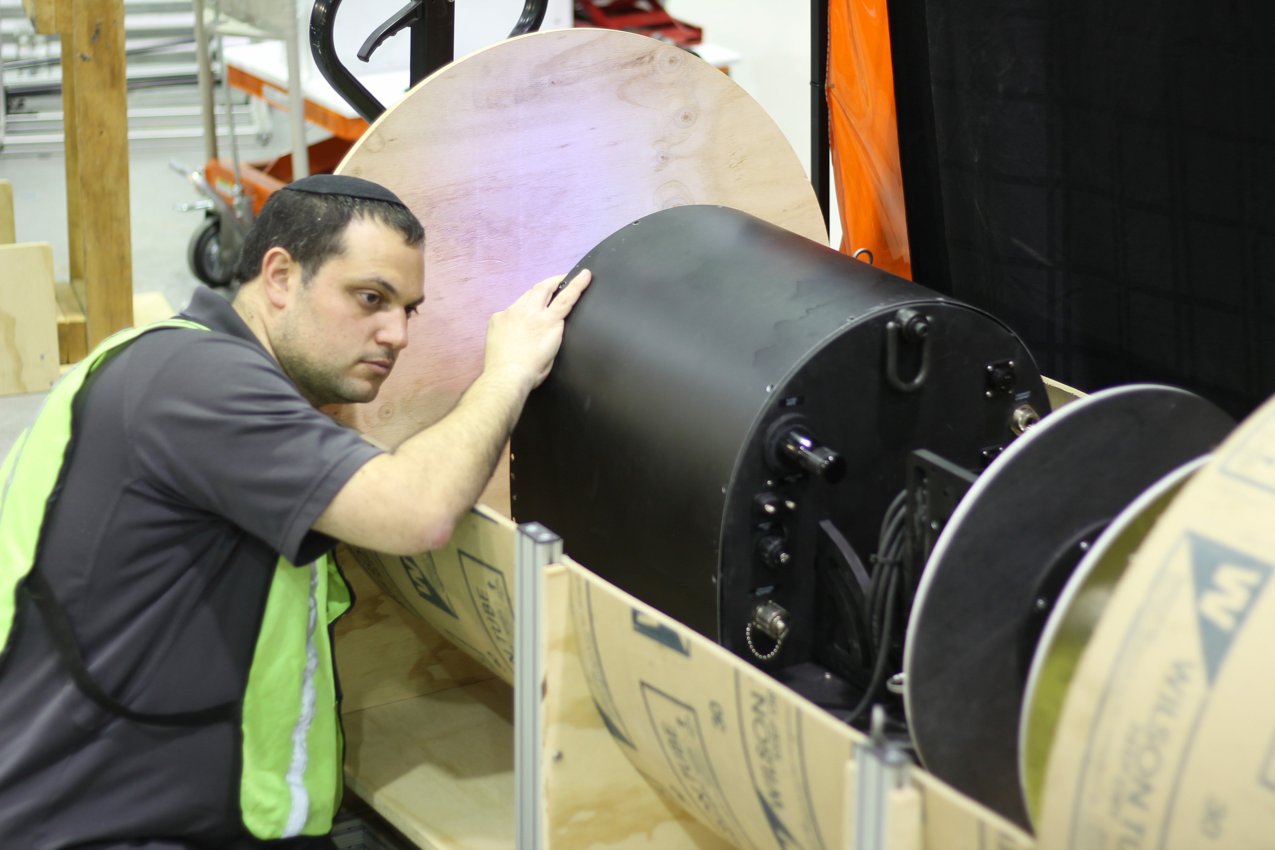 Photo of RadPiper launch shows David Kohanbash, senior research programmer in the Robotics Institute, preparing RadPiper for a test in a pipe mockup.