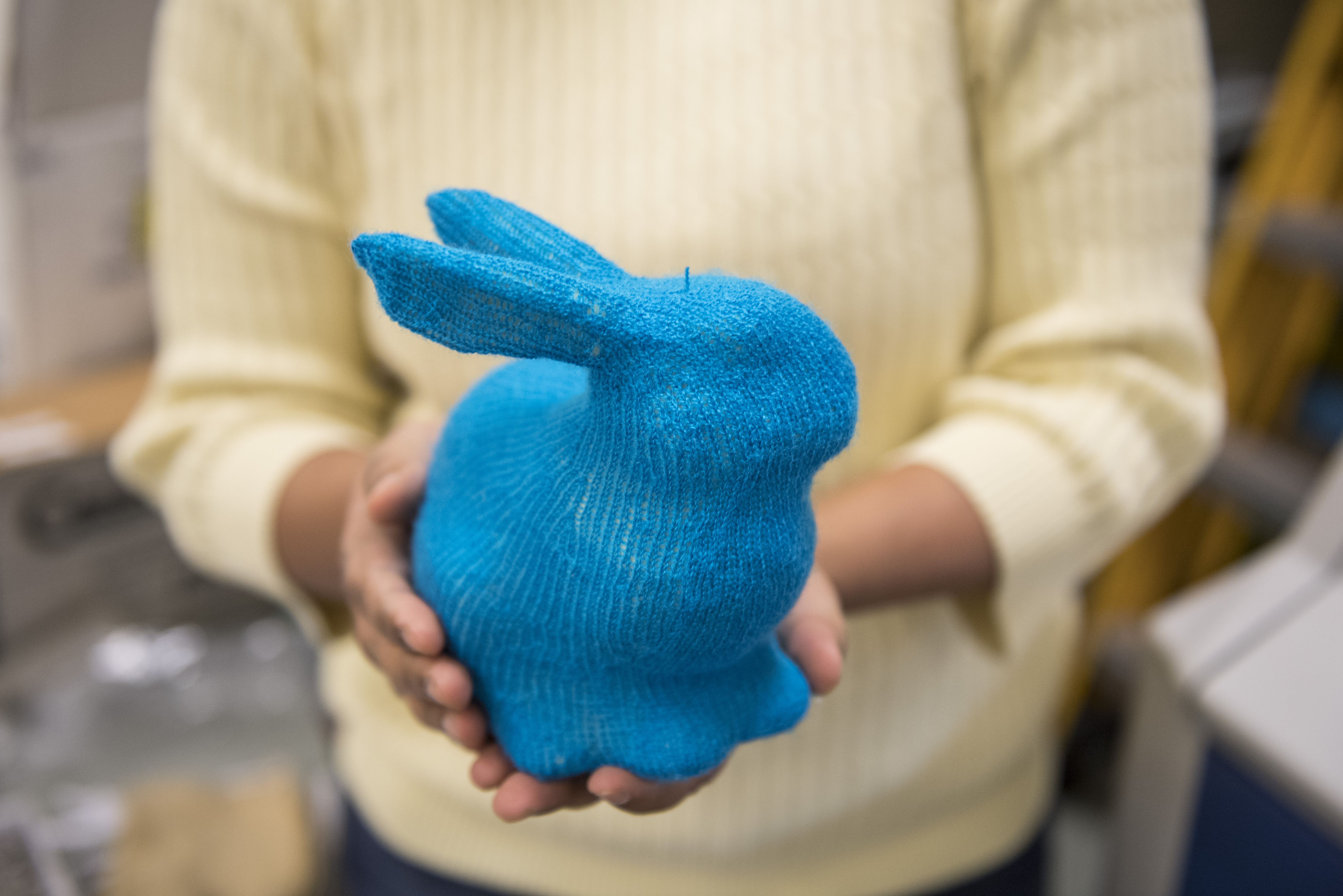 Photo of Narayanan holding a plush bunny produced using the research team’s system