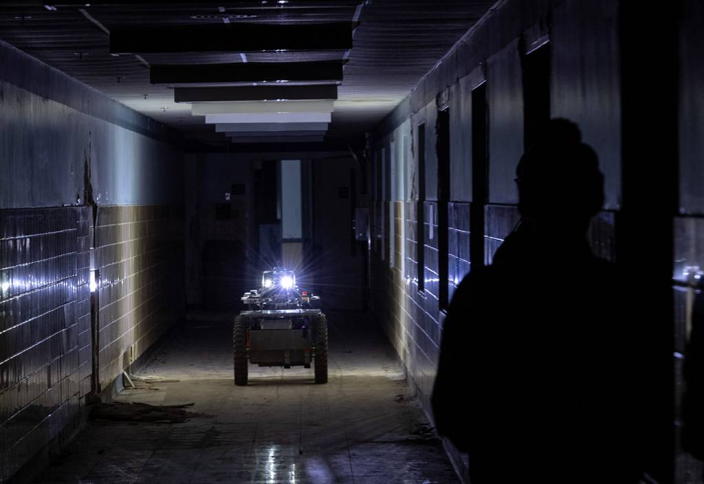 Robot in dark hallway