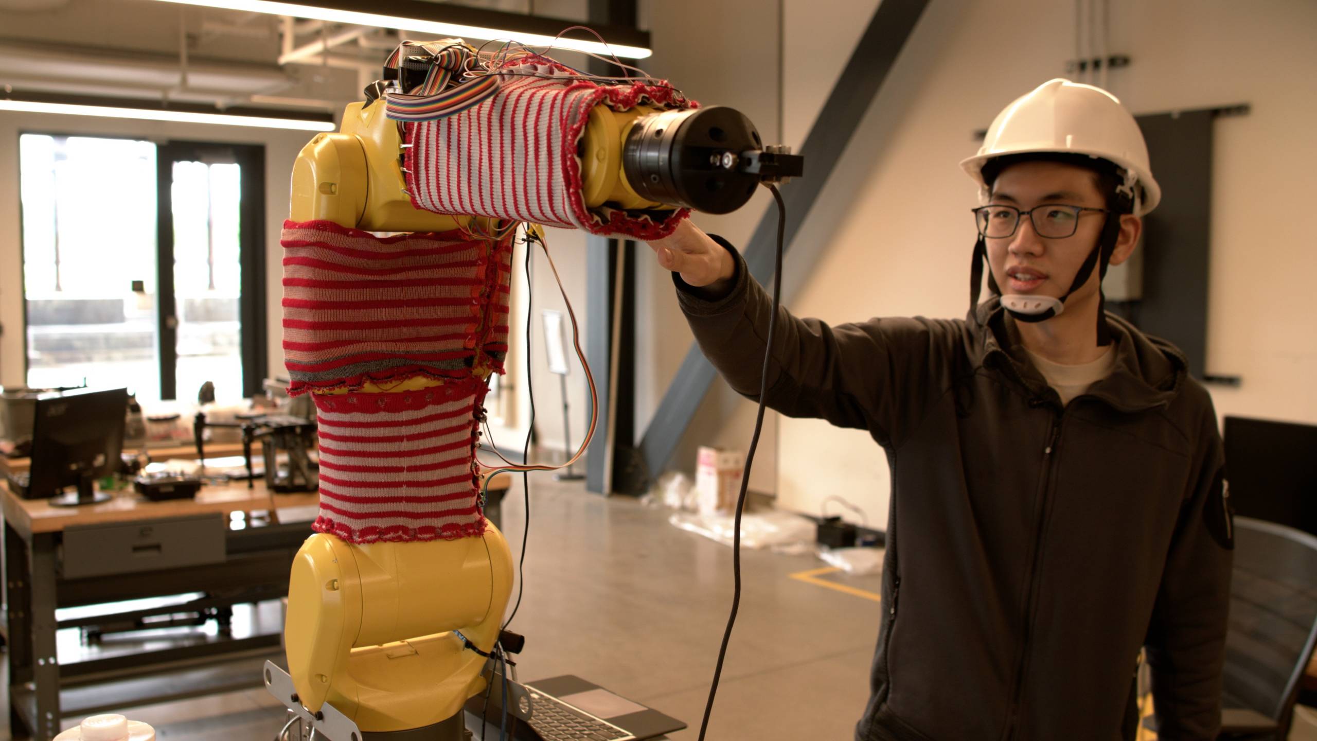 Image for Sweater-Wrapped Robots Can Feel and React to Human Touch